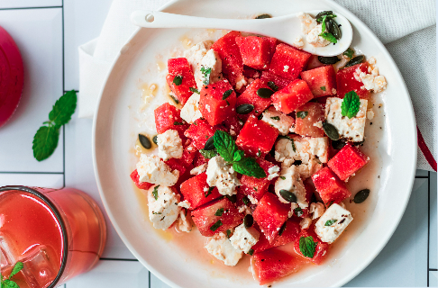 A fresh watermelon salad with mint, feta and olives. Sweet and savory!